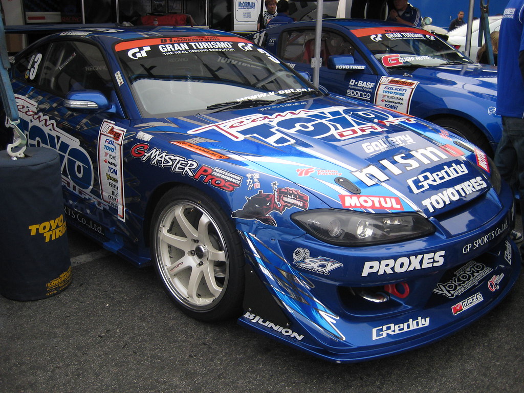 Naoki Nakamura's Team Toyo Tires Drift Nissan Silvia S15 mid-corner at a Drift Masters Japan round