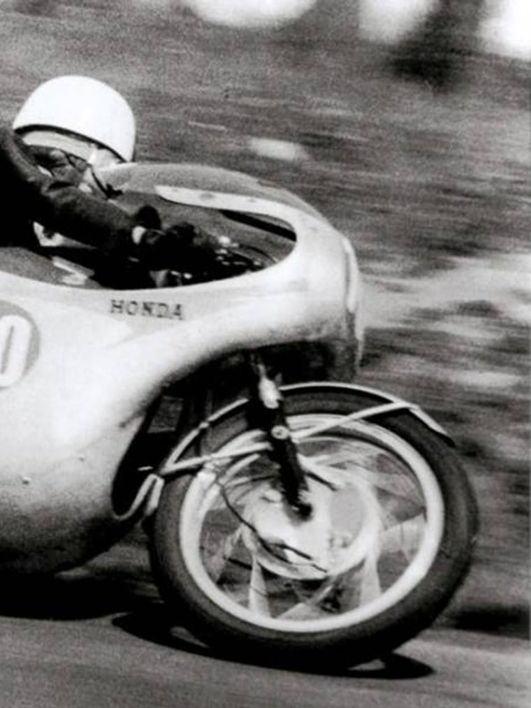 Kunimitsu Takahashi racing a Honda works Grand Prix motorcycle