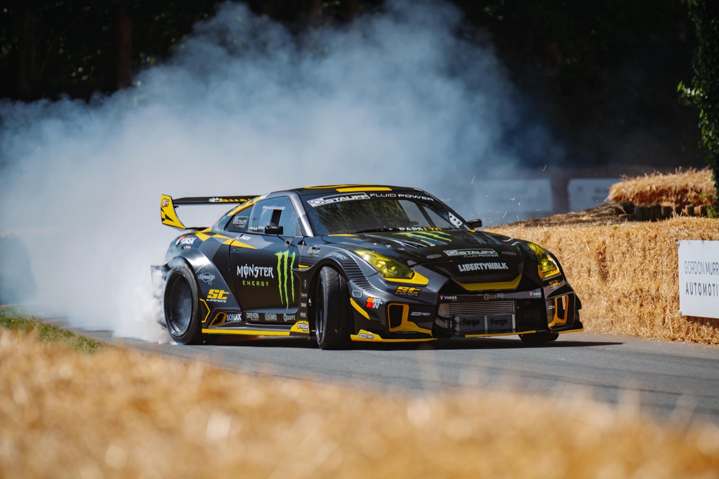 Steve "Baggsy" Biagioni drifting his wide-body Monster Energy Nissan GT-R in a cloud of tyre smoke