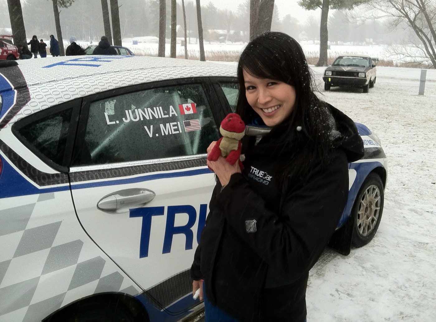Verena Mei, American drift and rally driver, beside her competition car